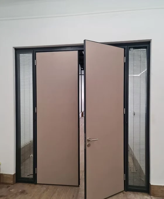 Custom entrance door with dark aluminum framing